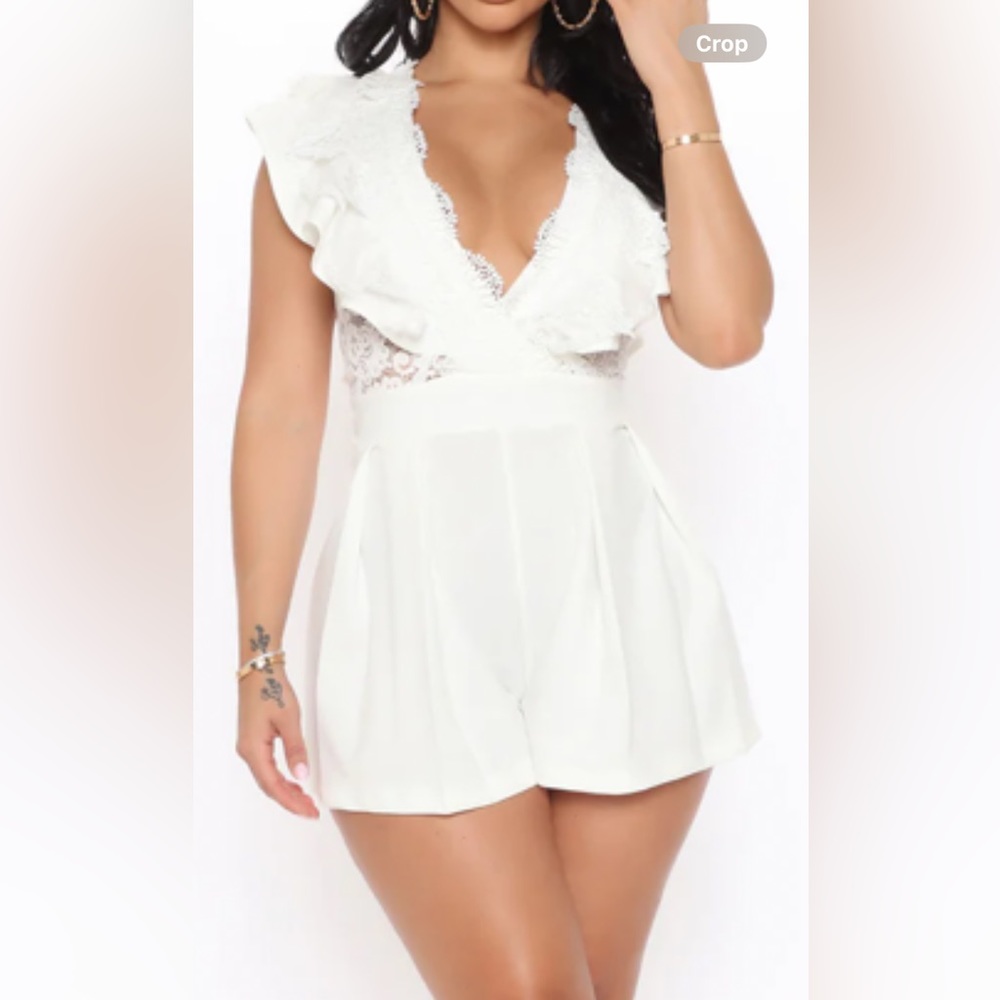 This beautiful white romper is to die for.